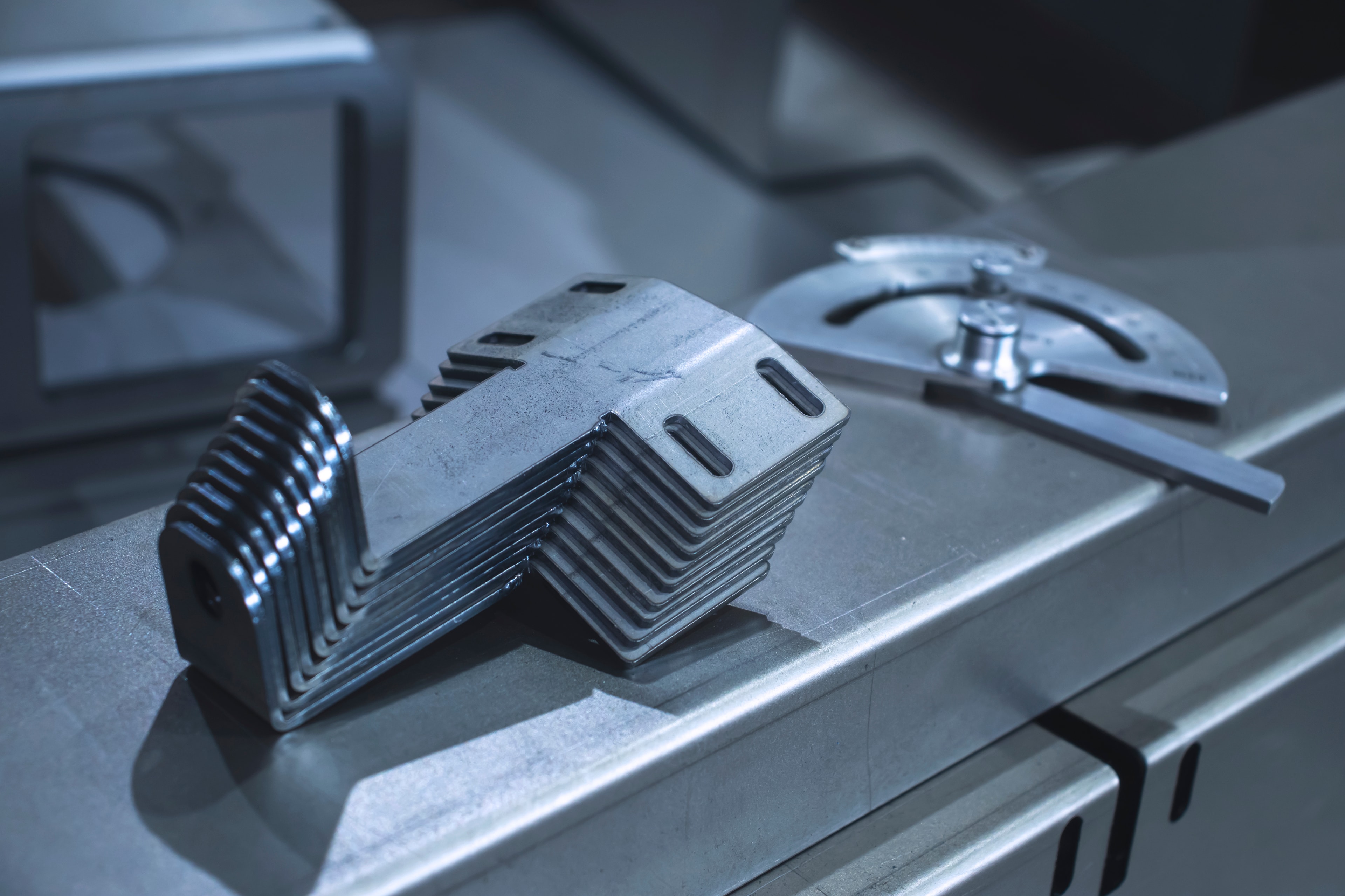 Sheet metal cutting and bending fabrication producing precision components